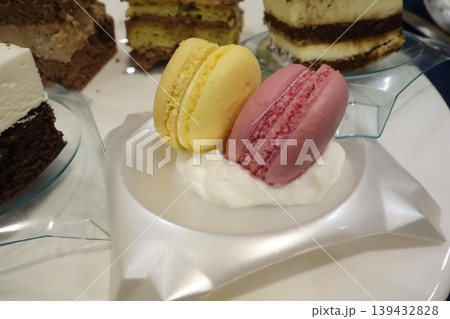 Macarons and Layered Cakes Dessert Display 139432828