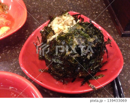 Seaweed-Wrapped Rice Dish on Red Plate 139433069
