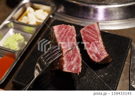Sliced Steak with Fork and Side Dishes Sliced Steak with Fork and Side Dishes 139433145