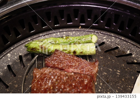 Grilled Steak and Asparagus on Charcoal Grill 139433155
