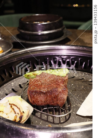 Grilled Steak with Onions on Charcoal Grill Grilled Steak with Onions on Charcoal Grill 139433156