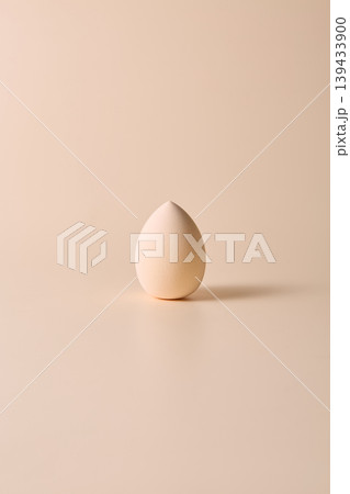 Minimal beige makeup sponge on neutral background Minimal beige makeup sponge on neutral background 139433900