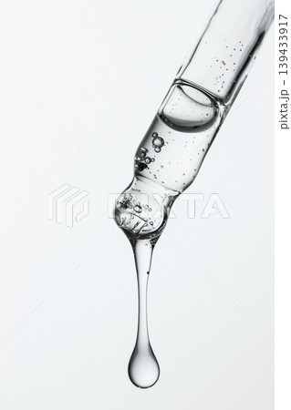 Macro Glass Pipette With Glossy Serum Drop Macro Glass Pipette With Glossy Serum Drop 139433917