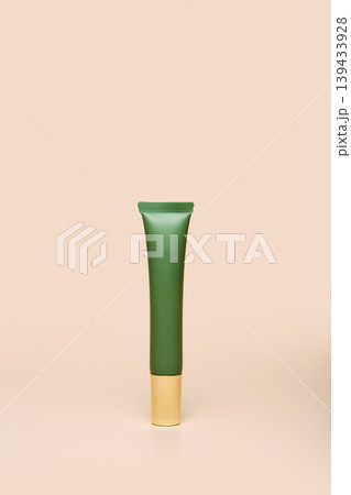 Green beauty tube on beige background Green beauty tube on beige background 139433928