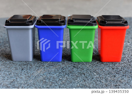 Colorful recycling bins lined up, waste sorting, sustainability 139435350