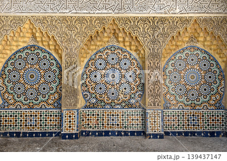 Ornamental and colorful arabesque carvings, mosaic tiles, zellige, medina of Tangier, Morocco 139437147