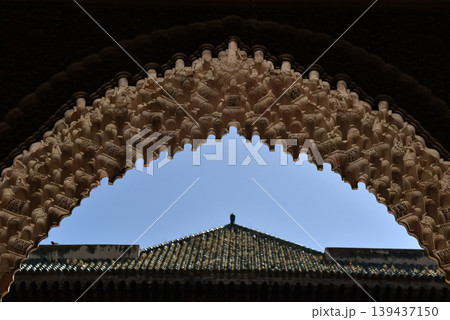 Carved stone gate arch, carved wooden architectural details, Medersa bou Inania, Fez, Morocco Carved stone gate arch, carved wooden architectural details, Medersa bou Inania, Fez, Morocco 139437150