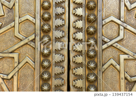 Brass doors adorned with Moroccan patterns, metal filigree, and intricate relief work. Royal Palace, Fez, Morocco 139437154