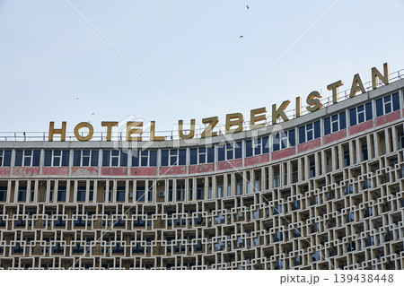 HOTEL UZBEKISTAN. Exterior facade of historic hotel building in Tashkent with geometric concrete design. Landmark architecture in city. Tashkent , Uzbekistan - 3 APR 2026. HOTEL UZBEKISTAN. Exterior facade of historic hotel building in Tashkent with geometric concrete design. Landmark architecture in city. Tashkent , Uzbekistan - 3 APR 2026. 139438448