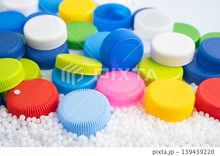 Colorful plastic bottle caps pile. 139439220