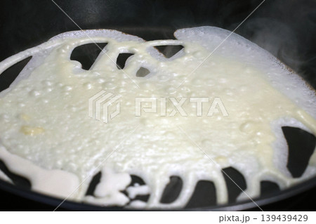 Cooking Pancake Crepe in Skillet - Home Cooking Breakfast Preparation Cooking Pancake Crepe in Skillet - Home Cooking Breakfast Preparation 139439429