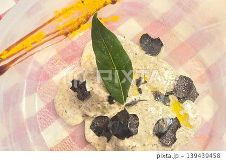 Gourmet Italian Cuisine with Truffle and Cream Sauce on a Rustic Tablecloth Gourmet Italian Cuisine with Truffle and Cream Sauce on a Rustic Tablecloth 139439458