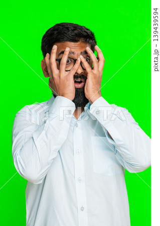 Indian man covering face with hands showing panic fear emotional stress moment of mental overload Indian man covering face with hands showing panic fear emotional stress moment of mental overload 139439594