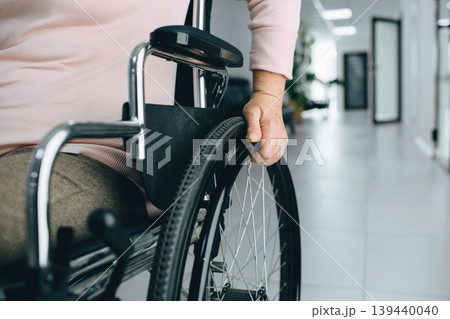 Closeup shot of an unrecognizable senior woman sitting in a wheelchair Closeup shot of an unrecognizable senior woman sitting in a wheelchair 139440040