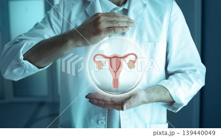 reproductologist holding a holographic model of the uterus and ovaries. Infertility Treatment Concept reproductologist holding a holographic model of the uterus and ovaries. Infertility Treatment Concept 139440049