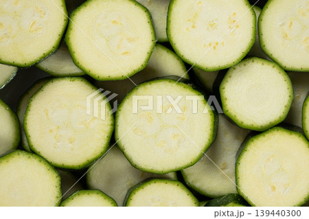 Top View of Fresh Sliced Zucchini Rounds Arranged Together. Top View of Fresh Sliced Zucchini Rounds Arranged Together. 139440300