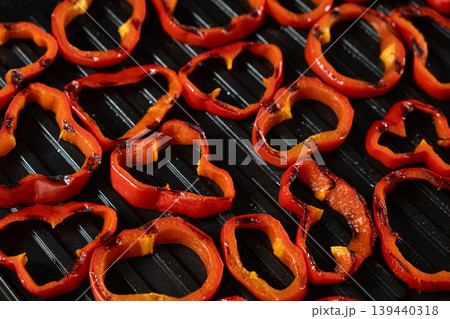Grilled red pepper rings on electric grill 139440318