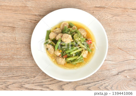 spicy stir fried yard long bean and pork meatball with chili couple basil on plate 139441006