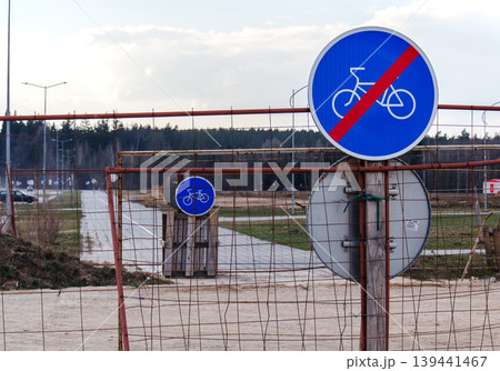 End of bicycle path sign with a blue circular sign and red diagonal line End of bicycle path sign with a blue circular sign and red diagonal line 139441467