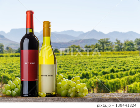 Red and white wine bottles with grapes Red and white wine bottles with grapes 139441824