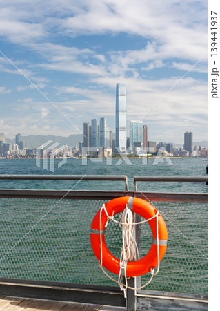 Hong Kong skyscraper panorama on a sunny day with water and boats Hong Kong skyscraper panorama on a sunny day with water and boats 139441937