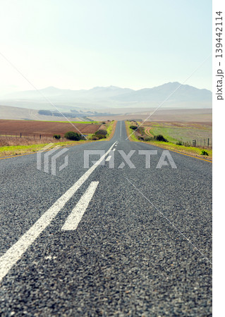 Endless road to horizon through fields and mountains Endless road to horizon through fields and mountains 139442114