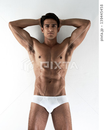 Portrait, muscle and man with underwear, beauty and confident guy isolated on a white studio background. Person, mockup space and model with body, healthy and wellness with fitness and natural 139445458