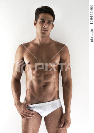 Portrait, muscle and man with underwear, fitness and confident guy isolated on a white studio background. Person, mockup space and model with bodybuilding, healthy and natural with wellness and abs Portrait, muscle and man with underwear, fitness and confident guy isolated on a white studio background. Person, mockup space and model with bodybuilding, healthy and natural with wellness and abs 139445466