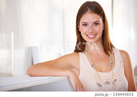 Happy, woman and portrait at reception desk in office with confidence in administration of business. Secretary, smile and receptionist welcome in lobby or pride for working in company and morning Happy, woman and portrait at reception desk in office with confidence in administration of business. Secretary, smile and receptionist welcome in lobby or pride for working in company and morning 139445653