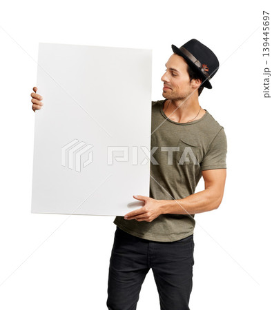 Poster, mockup and information with a hipster man in studio isolated on a white background for marketing. Space, sign or placard with a confident young person holding a billboard for an announcement 139445697