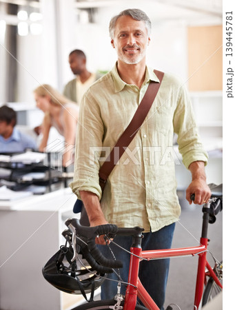 Mature, businessman and bicycle in office with portrait and manager of sustainable company. Ceo, boss and job with eco friendly commute in morning with smile in a creative agency of a professional Mature, businessman and bicycle in office with portrait and manager of sustainable company. Ceo, boss and job with eco friendly commute in morning with smile in a creative agency of a professional 139445781