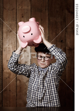 Piggy bank, smash and sad boy child with investment, growth or savings fail at home. Economy, inflation and unhappy kid with money, box or cash container for emergency payment, loan or empty account Piggy bank, smash and sad boy child with investment, growth or savings fail at home. Economy, inflation and unhappy kid with money, box or cash container for emergency payment, loan or empty account 139445918