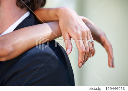 Love, wedding day and hands of bride hug groom in celebration of union, commitment or event closeup. Marriage, ceremony and finger jewellery zoom on ring of woman embracing man with romance or trust Love, wedding day and hands of bride hug groom in celebration of union, commitment or event closeup. Marriage, ceremony and finger jewellery zoom on ring of woman embracing man with romance or trust 139446058