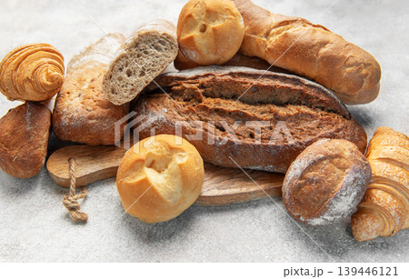 Assortment of fresh baked crusty artisan bread and croissants Assortment of fresh baked crusty artisan bread and croissants 139446121