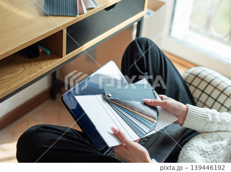 Person choosing color samples for home interior design project Person choosing color samples for home interior design project 139446192