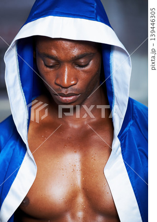 Black man, boxing champion and robe getting ready for fight, challenge or sports competition at gym. Face of serious African male person, fighter or professional boxer in MMA, match or game start Black man, boxing champion and robe getting ready for fight, challenge or sports competition at gym. Face of serious African male person, fighter or professional boxer in MMA, match or game start 139446305