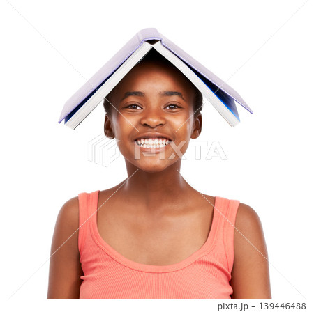 Portrait, smile and black girl with book on her head, education and balance isolated on a white studio background. Face, African person and model with mockup space and learning with student or kid Portrait, smile and black girl with book on her head, education and balance isolated on a white studio background. Face, African person and model with mockup space and learning with student or kid 139446488
