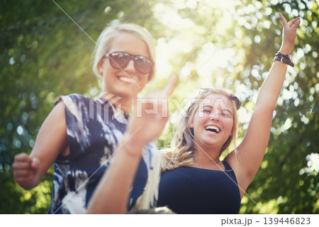 Portrait, outdoor and women with celebration, dancing and nature with happiness, smile and cheerful. Face, people and friends with music festival, concert and energy with culture, environment and joy Portrait, outdoor and women with celebration, dancing and nature with happiness, smile and cheerful. Face, people and friends with music festival, concert and energy with culture, environment and joy 139446823