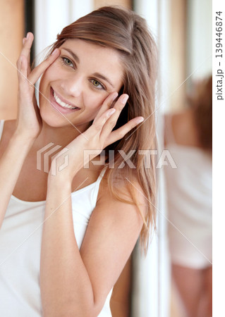 Mirror, facial massage and happy woman in bathroom for morning skincare routine, dermatology and beauty. Smile, reflection and girl with acupressure on face, cosmetics and skin care glow in home. Mirror, facial massage and happy woman in bathroom for morning skincare routine, dermatology and beauty. Smile, reflection and girl with acupressure on face, cosmetics and skin care glow in home. 139446874