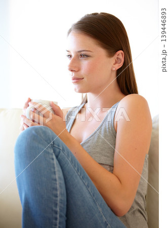 Home, thinking and woman on a couch, coffee cup and relax with ideas, wellness and peace in a living room. Apartment, girl and person on a sofa, tea and decision with a choice, daydreaming and calm Home, thinking and woman on a couch, coffee cup and relax with ideas, wellness and peace in a living room. Apartment, girl and person on a sofa, tea and decision with a choice, daydreaming and calm 139446893