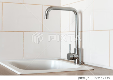 Modern kitchen sink with stainless steel faucet Modern kitchen sink with stainless steel faucet 139447439