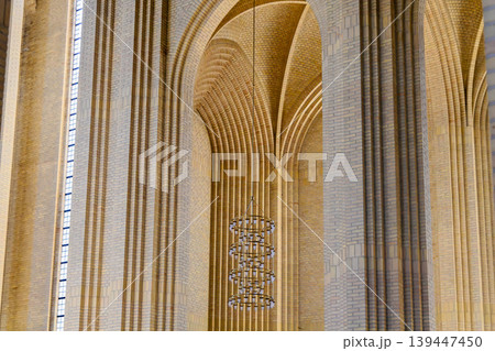 Geometric brick vaults and arches inside Scandinavian church architecture. Geometric brick vaults and arches inside Scandinavian church architecture. 139447450
