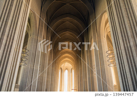 Grundtvigs Church interior with monumental brick arches and Scandinavian Protestant architecture. 139447457
