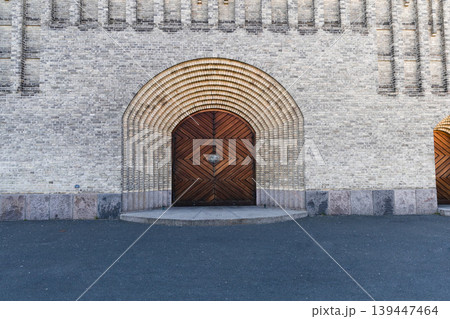 Central entrance with wooden door at Grundtvig Church in Copenhagen. Central entrance with wooden door at Grundtvig Church in Copenhagen. 139447464