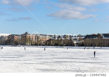 People walking on frozen lake in Copenhagen during unusual winter weather. Copenhagen, Denmark 139447492