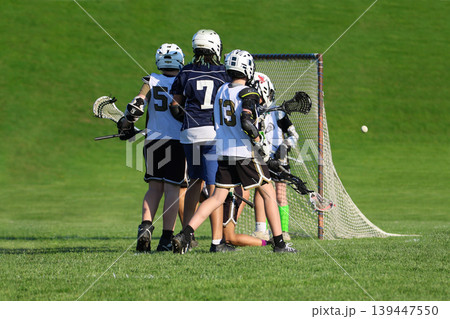 Young boys playing Lacrosse game 139447550