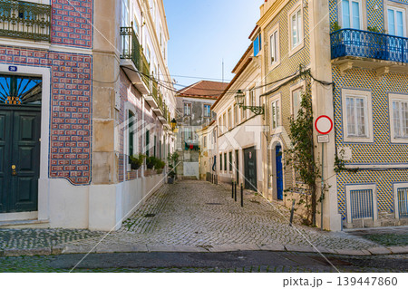 traditional lisbon street with cafe shadows and historic azulejo buildings traditional lisbon street with cafe shadows and historic azulejo buildings 139447860