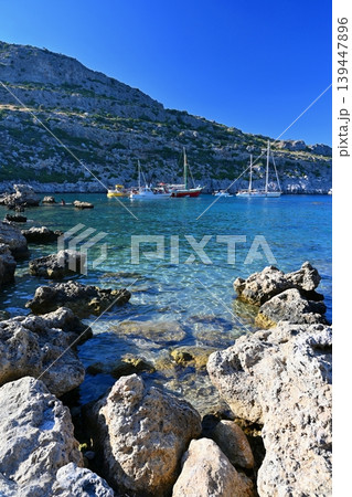 Peaceful seaside scenery on Rhodes island in Greece, clear water and relaxing summer atmosphere. Peaceful seaside scenery on Rhodes island in Greece, clear water and relaxing summer atmosphere. 139447896