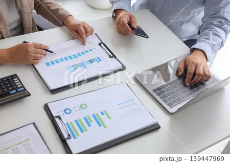 Business Team Meeting in the Office to Analyze Financial Report and Plan Strategy. Business Team Meeting in the Office to Analyze Financial Report and Plan Strategy. 139447969