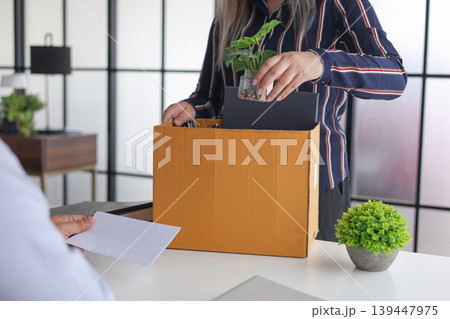 Manager Terminating Employee and Handing Over Severance Document. Manager Terminating Employee and Handing Over Severance Document. 139447975
